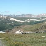 A mountain road with cars on it.