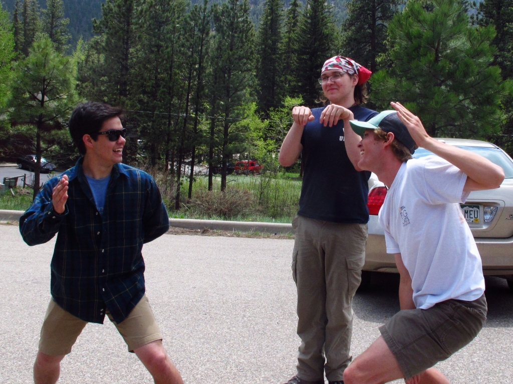 A group of people playing frisbee.