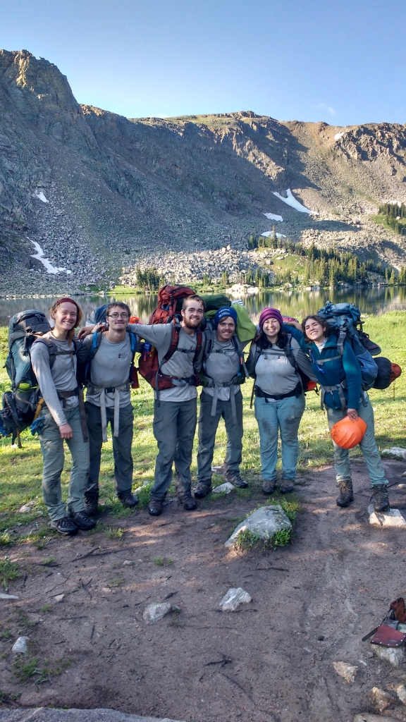 A group of hikers posing for a picture.