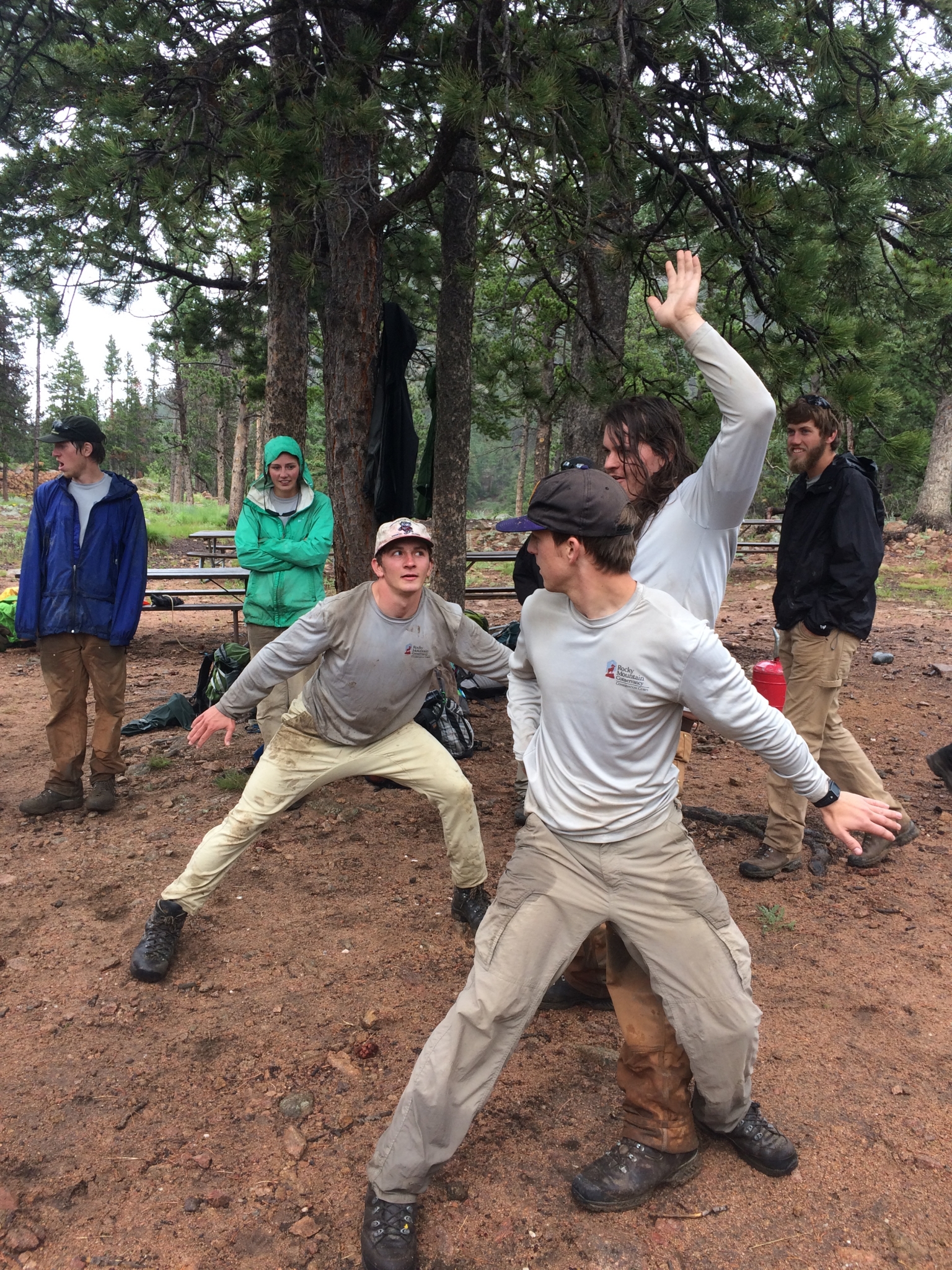 A group of people engaged in playful movement outdoors