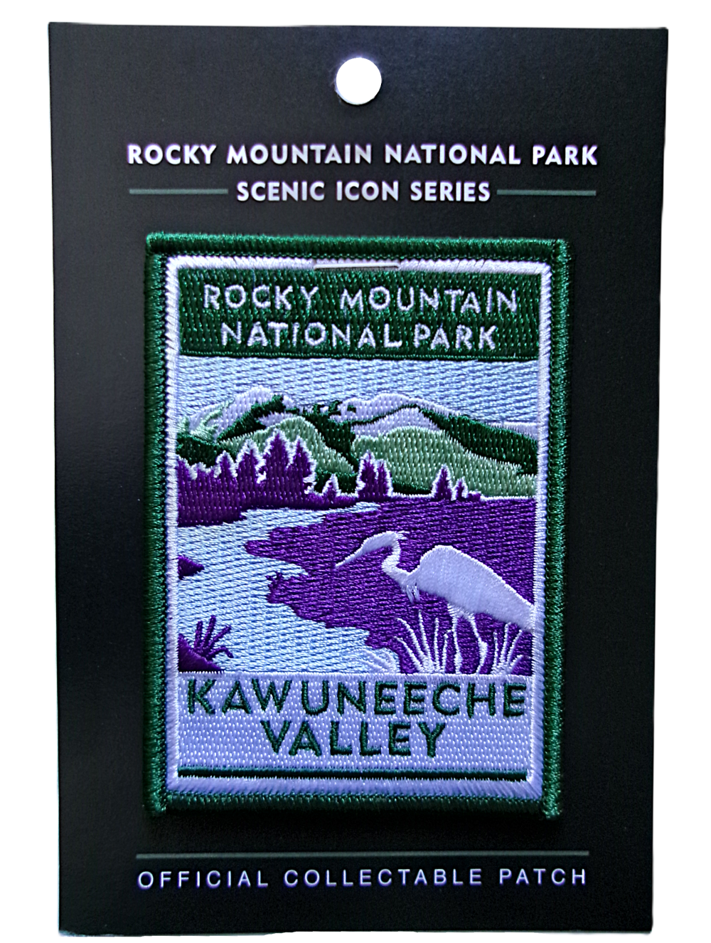 KVC Patch The Patch - RMNP Kawuneeche Valley shows a purple and green landscape with a river and a white animal, featuring Rocky Mountain National Park's Kawuneeche Valley. Part of the "Scenic Icon Series.