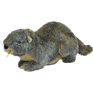 A plush marmot lying down on a black background.