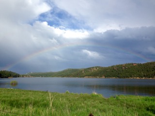 Rainbow visible over a lake