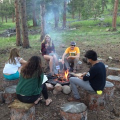 Group of friends camping at the forest