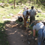 A group of people working on a trail.