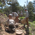 A group of people working on a trail.