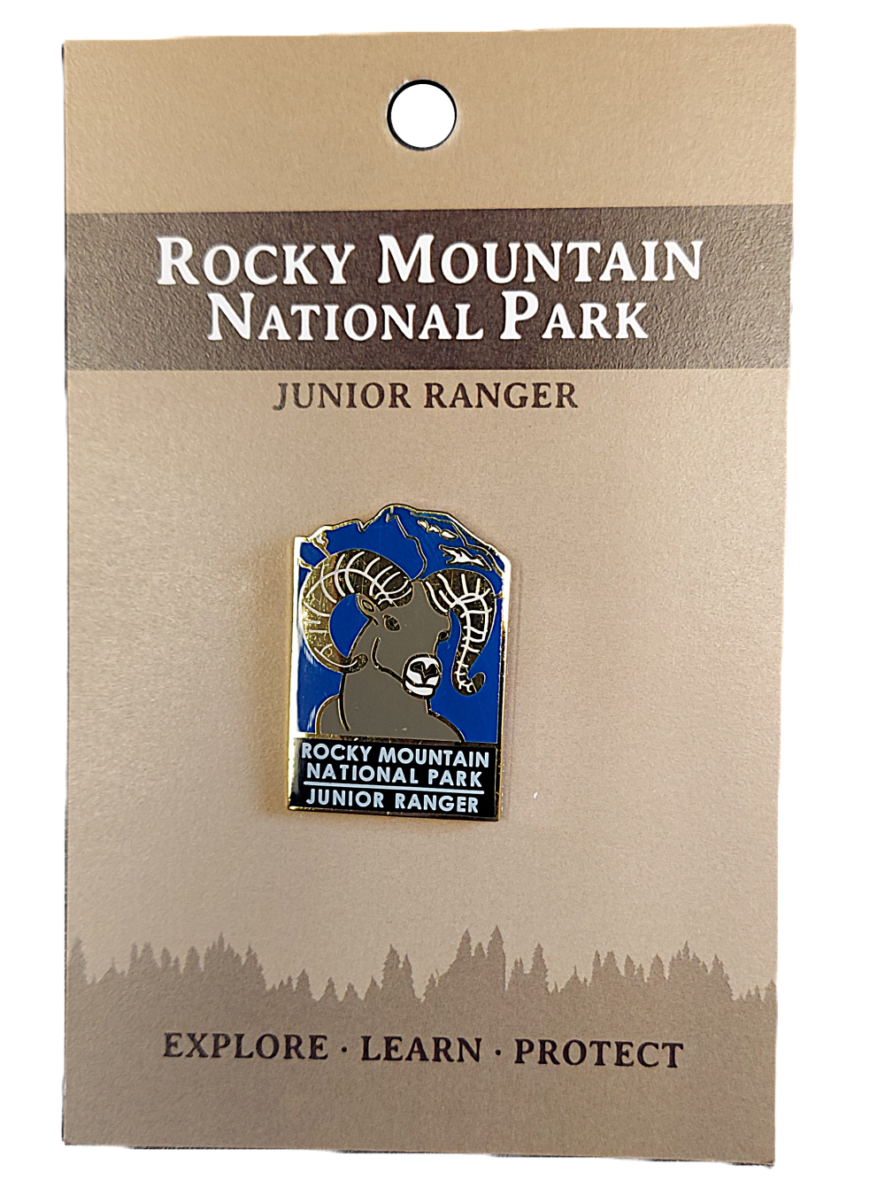 JR Ranger Junior Ranger pin featuring a ram on a blue background from Rocky Mountain National Park, attached to a branded card.