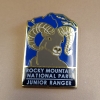 JR Ranger closeup Junior Ranger pin showcasing a bighorn sheep with the text: "Rocky Mountain National Park Junior Ranger.