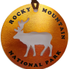 Copper-finished ornament featuring a cutout elk silhouette and “Rocky Mountain National Park” in black lettering around the edge. Product name: Ornament - Copper Elk.