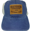 180 The Hat - RMNP Trucker is a blue trucker hat featuring a mesh back and a brown patch on the front that reads "Rocky Mountain National Park 1915.