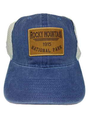 The Hat - RMNP Trucker is a blue trucker hat featuring a mesh back and a brown patch on the front that reads "Rocky Mountain National Park 1915.