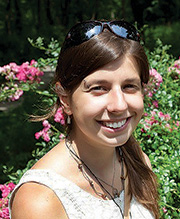 A woman wearing a white shirt.