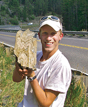 A man holding a rock.