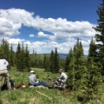 A group of people in a field.
