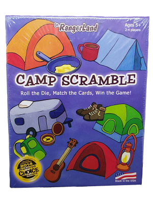 The "Camp Scramble" board game box features illustrations of tents, camping gear, and a frying pan. It's suitable for 2-4 players aged 5 and up and is made in the USA.