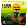 Box of "Mini Building Blocks - Junior Ranger Green," includes 211 pieces to assemble a ranger figure with a yellow hat, green attire, and accessories. Suitable for ages 7 and up.