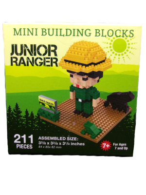 Box of "Mini Building Blocks - Junior Ranger Green," includes 211 pieces to assemble a ranger figure with a yellow hat, green attire, and accessories. Suitable for ages 7 and up.