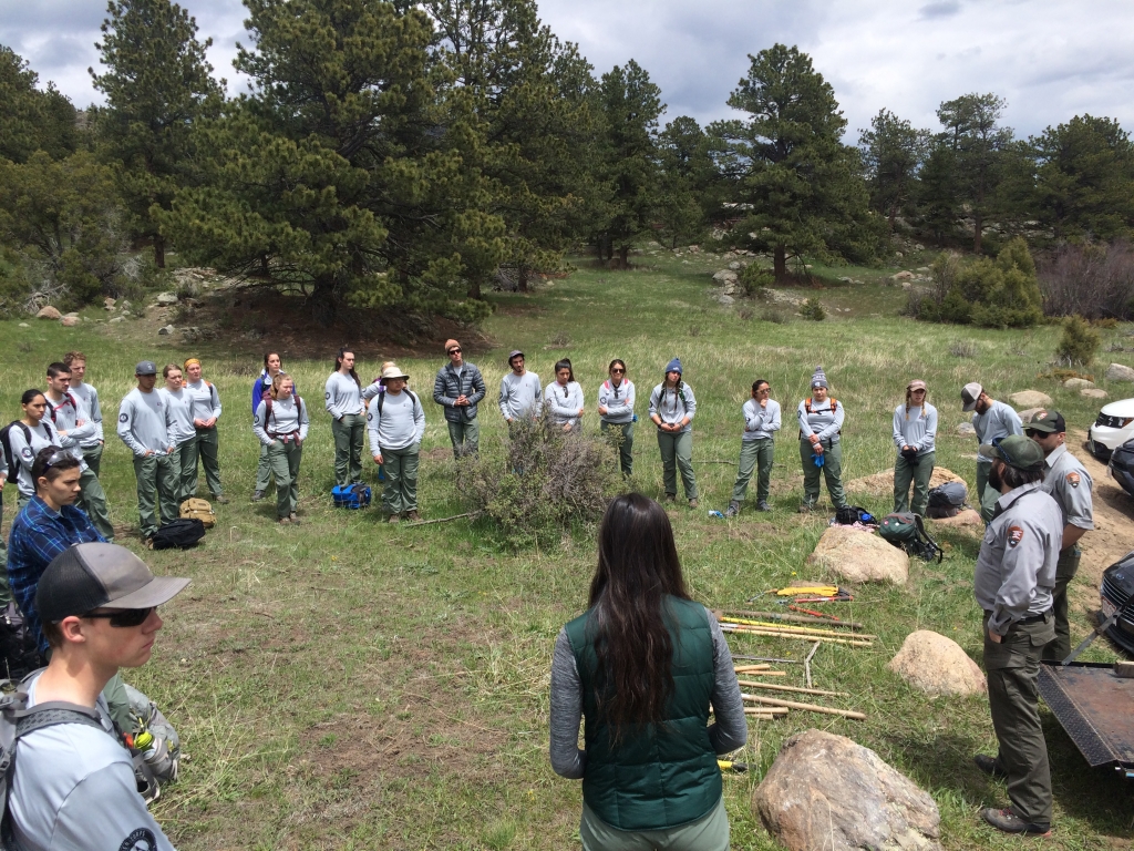 A group of people standing in a field.