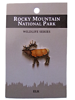 Enamel pin of an elk on a card labeled "RMNP North American Wildlife Series Elk.