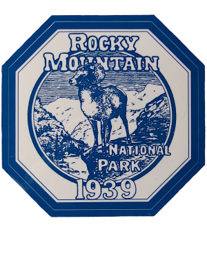 Hexagonal blue and white badge sticker featuring a ram, mountains, and the text "Rocky Mountain National Park 1939" from Sticker - RMNP Historic Park.