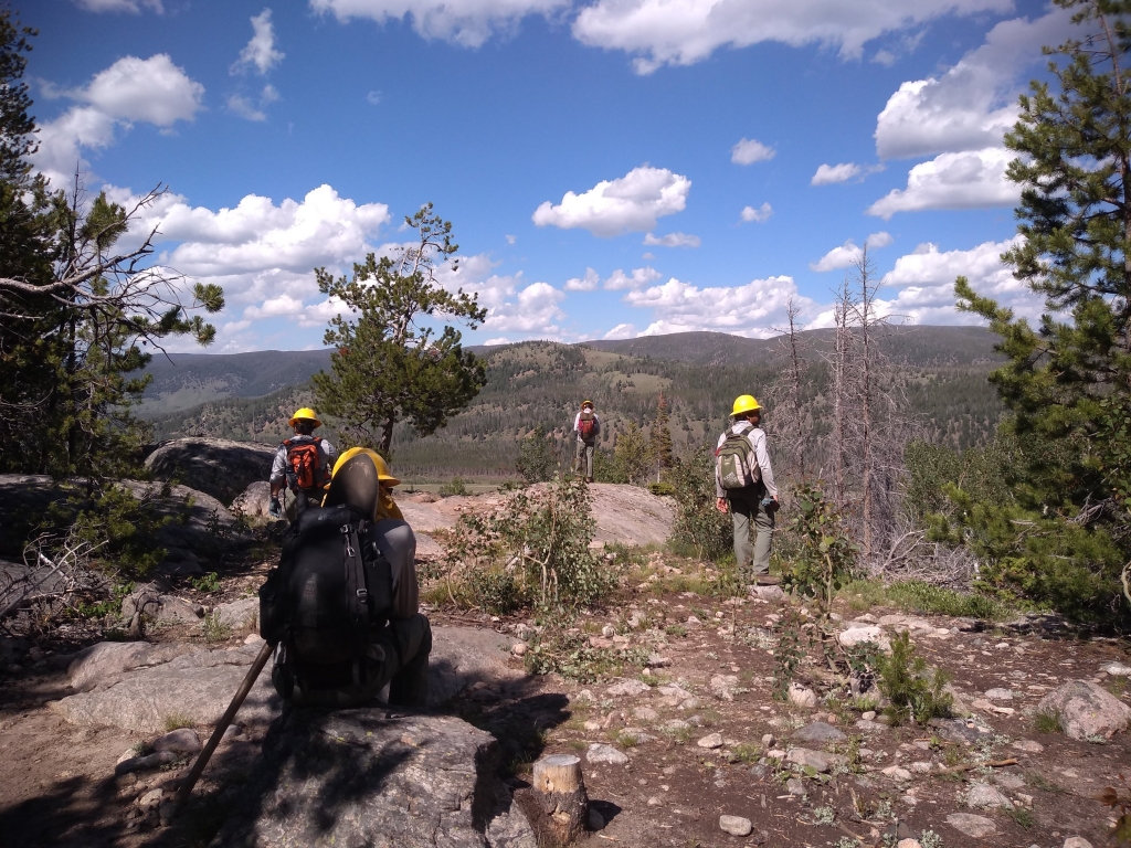 A group of hikers on a rocky trail.
