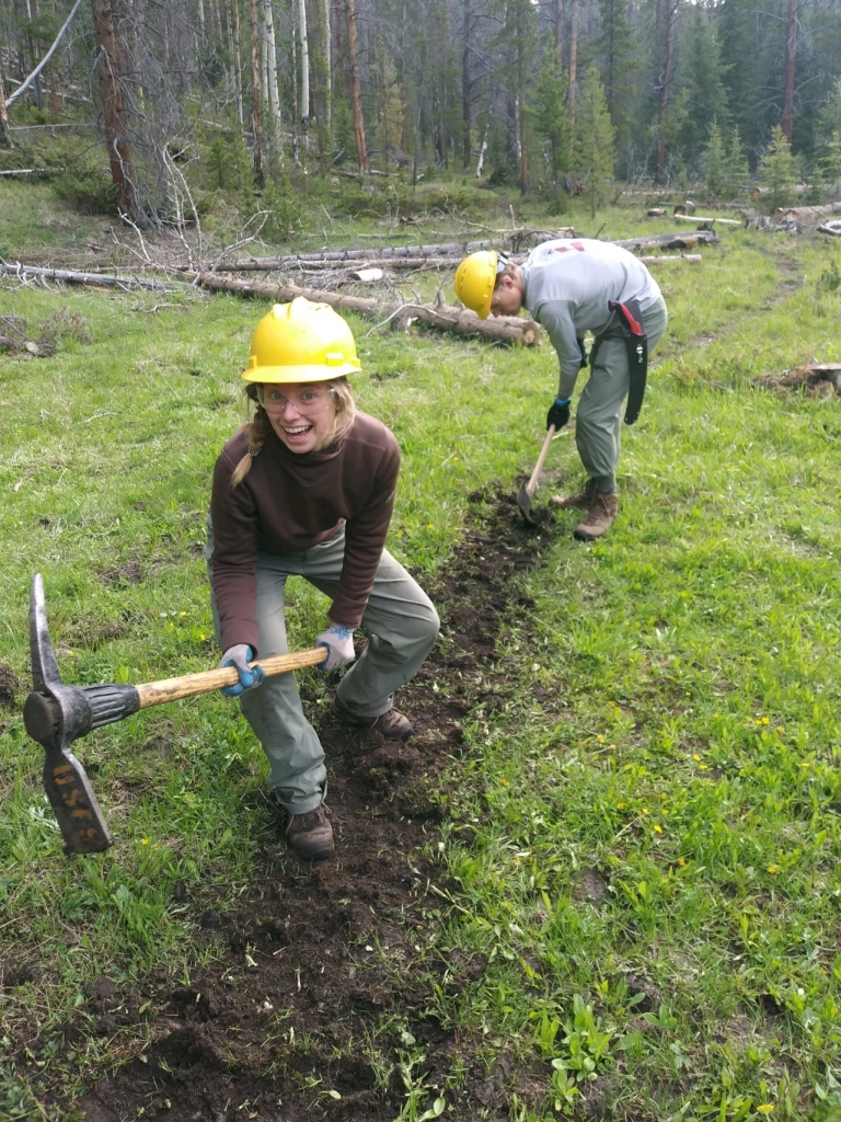 A woman wearing a yellow hat.