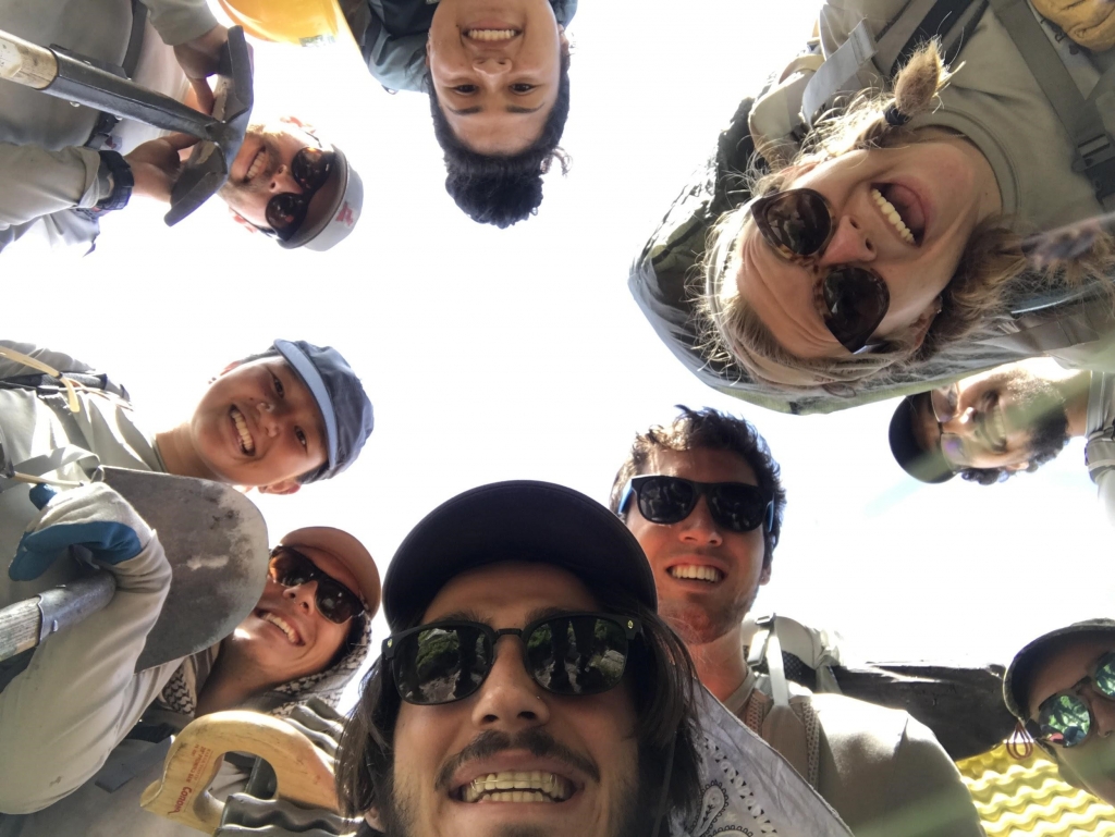 A group of people taking a selfie in a circle.