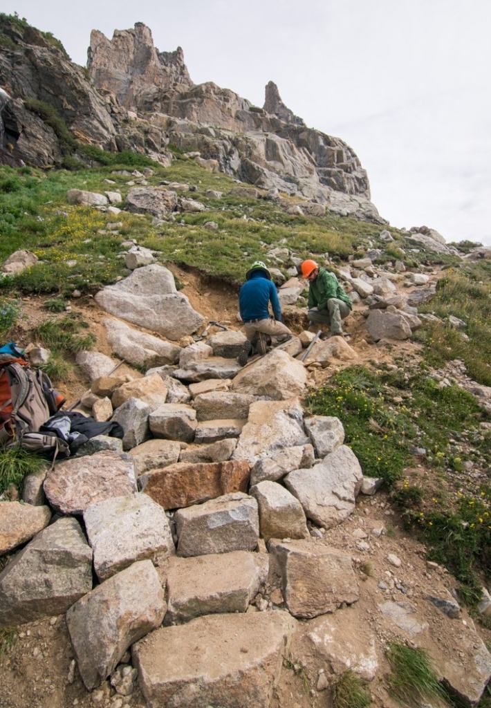 A group of hikers on a rocky trail.