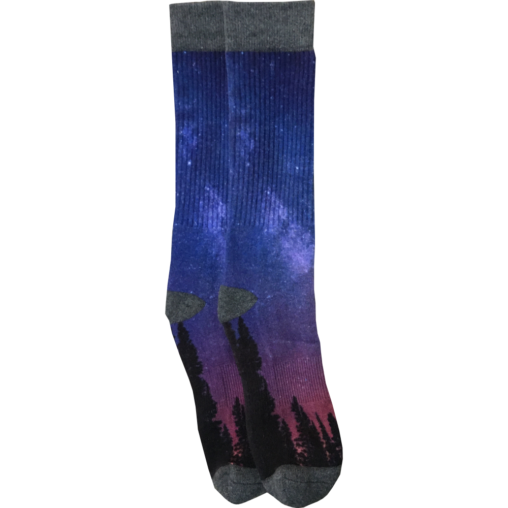A pair of Night Sky socks with an image of the milky way and trees.