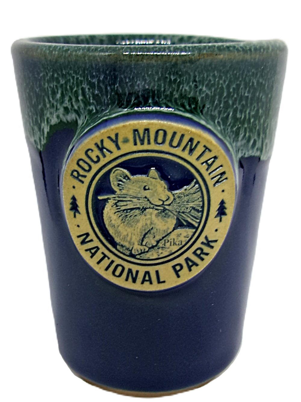 Navy and green shot glass featuring a "Rocky Mountain National Park" emblem with a pika illustration.