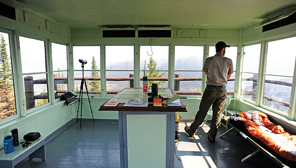 Man observing from a watchtower