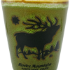 Shot glass featuring a black silhouette of an elk, sun, and tree landscape with the text: "Rocky Mountain National Park.