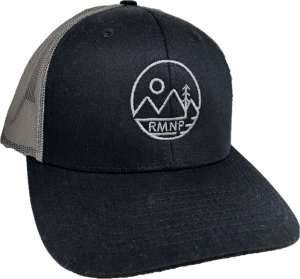 A black trucker hat with a Mountain Circle logo on it.