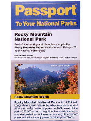 Sticker - RMNP Passport Stamp brochure includes a landscape photo of Rocky Mountain National Park's mountains and autumn foliage, along with details about the park and visitor statistics.