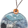 A round RMNP Bighorn Ram ornament with an image of a ram in the mountains.