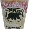 Red Bear Shot glass from Rocky Mountain National Park with a two-tone bear scene and textured purple and brown glaze.