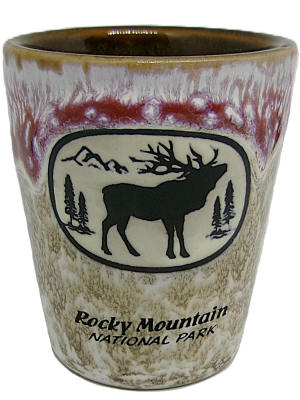 Shot glass featuring a Rocky Mountain National Park logo, showcasing an elk silhouette and mountain scene in two-tone shades.
