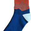 A blue and orange RMNP Tan Gradient sock with the word mountain on it.