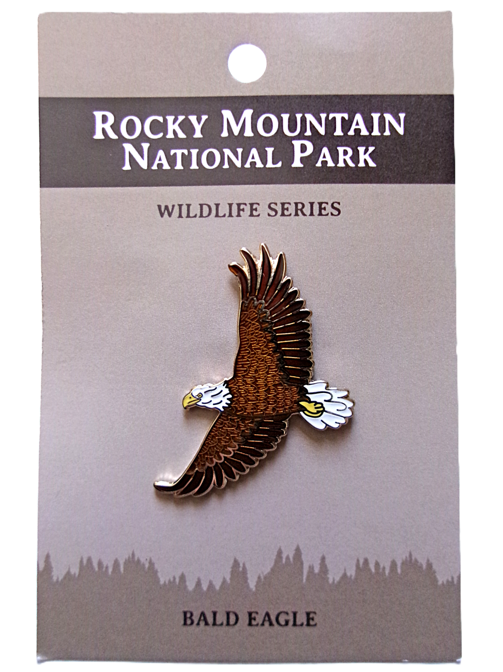 Bald Eagle Pin A pin showcasing a bald eagle in flight on a card titled "RMNP North American Wildlife Series.