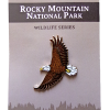 Bald Eagle Pin A pin showcasing a bald eagle in flight on a card titled "RMNP North American Wildlife Series.