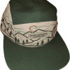 A green and beige Hat - RMNP Green Camper with a design of mountains, trees, and the text "Rocky Mountain National Park" on the front panel.