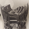 Gray T-shirt featuring a black and white illustration of Rocky Mountain National Park's Dream Lake, showcasing pine trees, mountains, and a moon in the background.