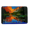 A scenic image of Dream Lake in Rocky Mountain National Park at sunset reflects mountains and trees. Text reads "Rocky Mountain National Park." Product Name: Magnet - RMNP Dream Lake.
