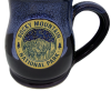 Deneen Night Sky Blue ceramic mug named "Mug - Deneen RMNP Longs Peak," featuring "Rocky Mountain National Park" emblem with mountain and trees design.
