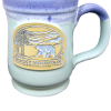 The Deneen RMNP Pepin Black Bear mug features a ceramic build with a purple rim and a gold emblem showcasing the Rocky Mountain National Park, complete with a bear and trees.