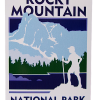 Hiker Sticker The Sticker-RMNP Travel Sticker Scenic Hiker showcases a hiker silhouette with a trekking pole against blue mountains and trees.