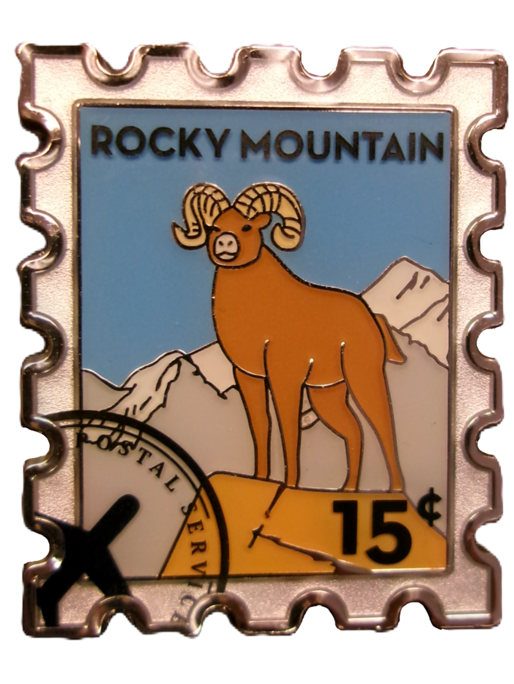Magnet featuring a bighorn sheep stamp from Rocky Mountain National Park, valued at 15 cents.