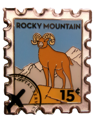Magnet featuring a bighorn sheep stamp from Rocky Mountain National Park, valued at 15 cents.