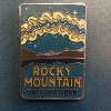 milky way pin close up A pin titled "RMNP Milky Way" featuring a night sky, mountains, and an aurora design.
