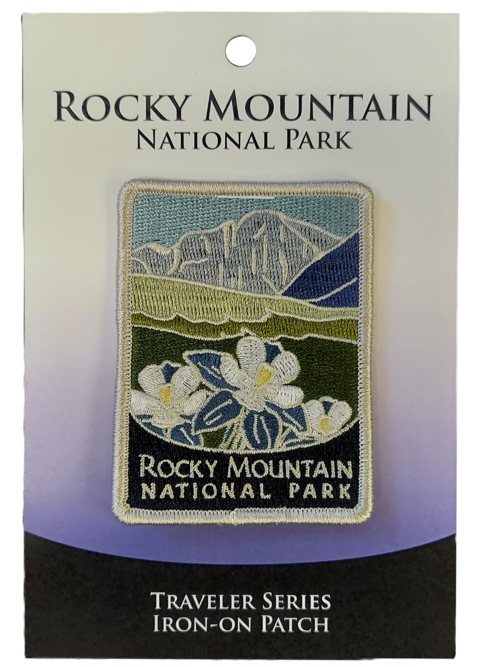 traveler patch Rocky Mountain National Park "Traveler Series" patch on display card, highlighting white flowers and mountain imagery.